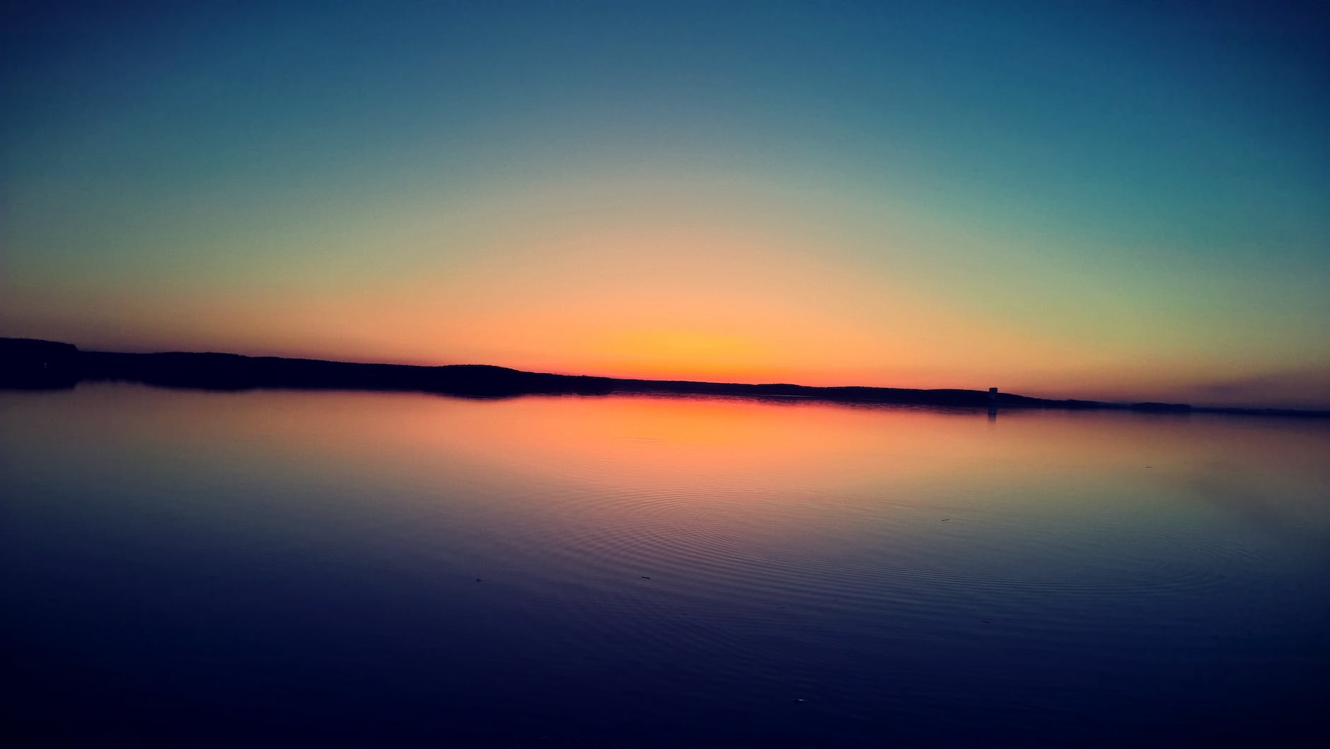 sunset on body of water